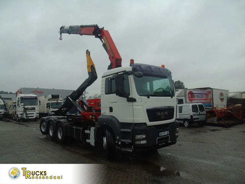 MAN TGS 35.440 + PALFINGER 24500 + 8X4 + EURO 5 + REMOTE - Hook-lift sunkvežimis, Sunkvežimis su kranu: foto 1 MAN TGS 35.440 + PALFINGER 24500 + 8X4 + EURO 5 + REMOTE - Hook-lift sunkvežimis, Sunkvežimis su kranu: foto 1