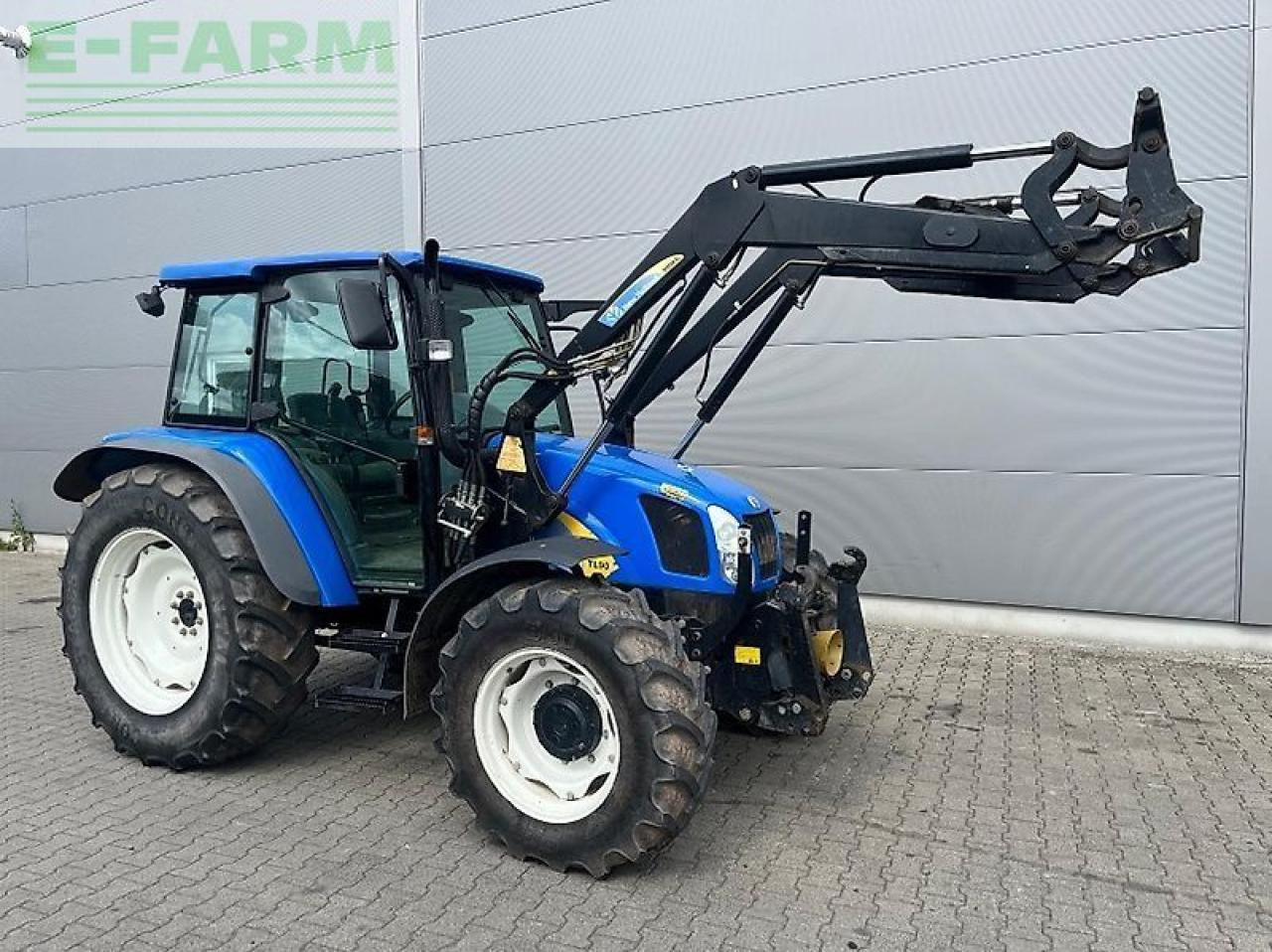 New Holland tl 90 a A - Traktorius: foto 1 New Holland tl 90 a A - Traktorius: foto 1