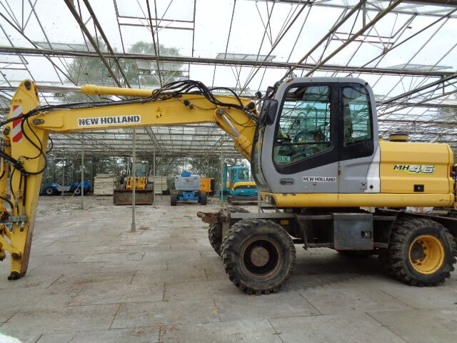 New Holland MH 4.6 - Ratinis ekskavatorius: foto 1 New Holland MH 4.6 - Ratinis ekskavatorius: foto 1