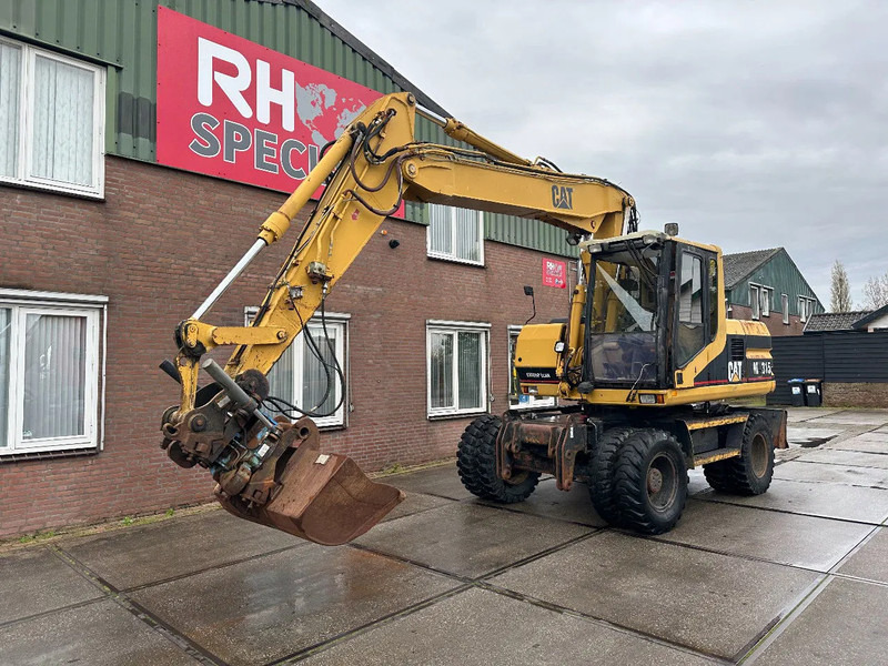 Caterpillar M315 +ROTO CE - Ratinis ekskavatorius: foto 2 Caterpillar M315 +ROTO CE - Ratinis ekskavatorius: foto 2