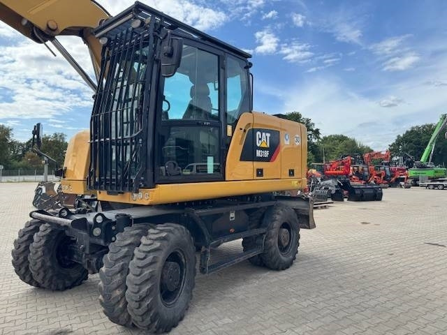 CAT M 318 F - Ratinis ekskavatorius: foto 1 CAT M 318 F - Ratinis ekskavatorius: foto 1