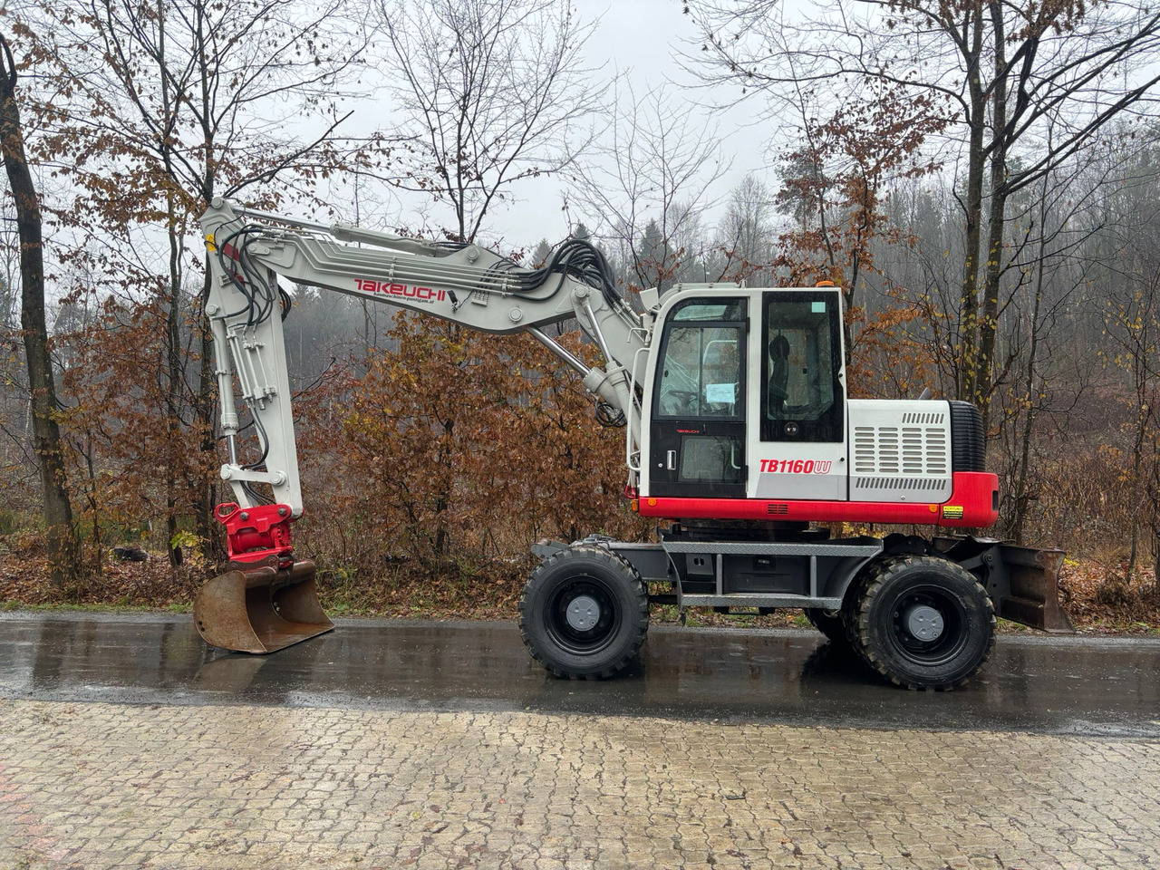 TAKEUCHI TB 1160 W - Ratinis ekskavatorius: foto 1 TAKEUCHI TB 1160 W - Ratinis ekskavatorius: foto 1