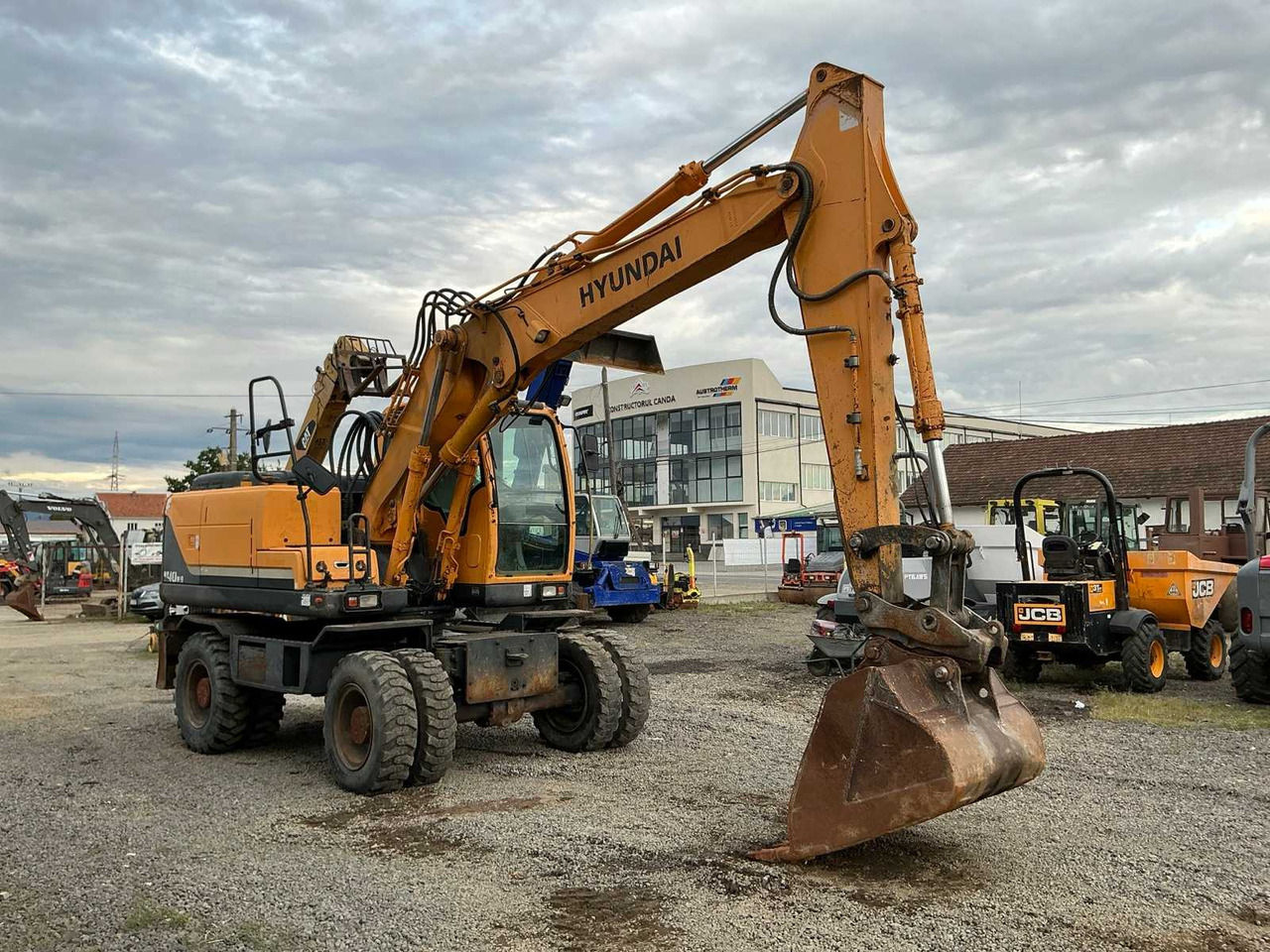HYUNDAI ROBEX 140W-9 - Ratinis ekskavatorius: foto 1 HYUNDAI ROBEX 140W-9 - Ratinis ekskavatorius: foto 1