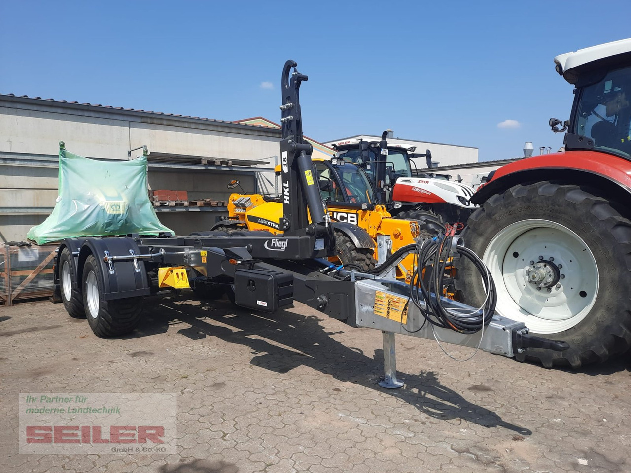 Fliegl HKL 18 Abrollkipper - Kablio/ Skip loader priekaba: foto 1 Fliegl HKL 18 Abrollkipper - Kablio/ Skip loader priekaba: foto 1