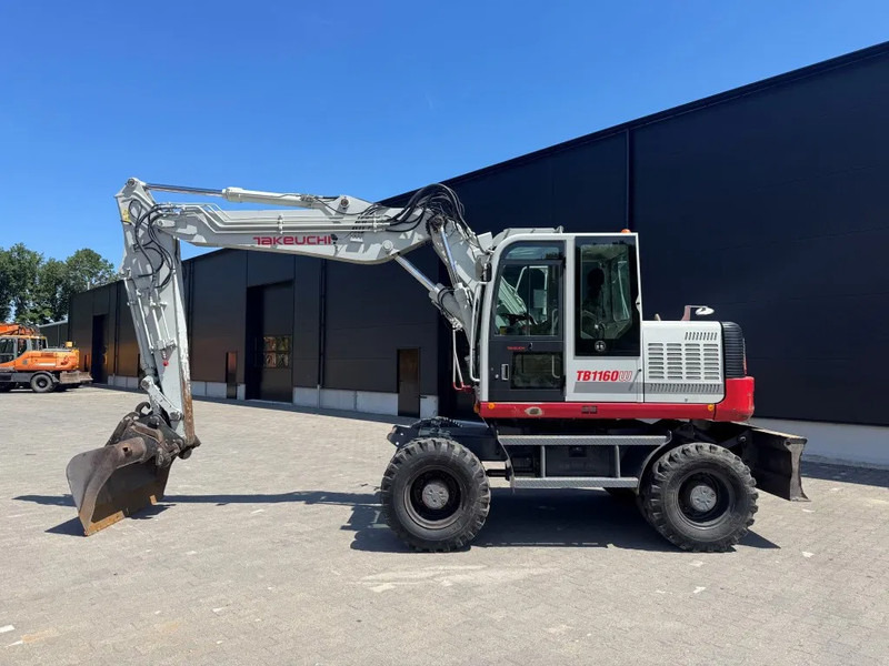 Takeuchi TB1160W - Ratinis ekskavatorius: foto 1 Takeuchi TB1160W - Ratinis ekskavatorius: foto 1