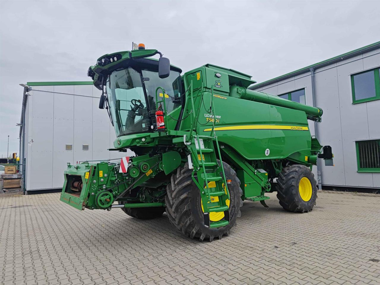 John Deere T560 Hillmaster - Derliaus nuėmimo kombainas: foto 1 John Deere T560 Hillmaster - Derliaus nuėmimo kombainas: foto 1