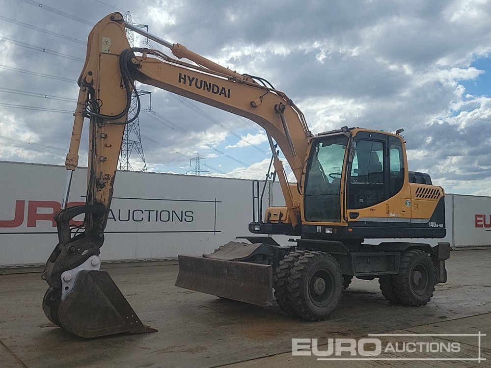 2015 Hyundai R140W-9A - Ratinis ekskavatorius: foto 1 2015 Hyundai R140W-9A - Ratinis ekskavatorius: foto 1