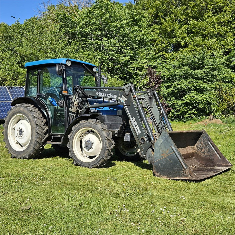 New Holland TN55D - Traktorius: foto 1 New Holland TN55D - Traktorius: foto 1