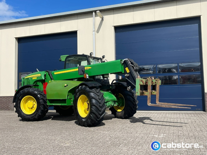 John Deere 3415 Verreiker met vorken en laadschop - Žemės ūkio technika: foto 2 John Deere 3415 Verreiker met vorken en laadschop - Žemės ūkio technika: foto 2