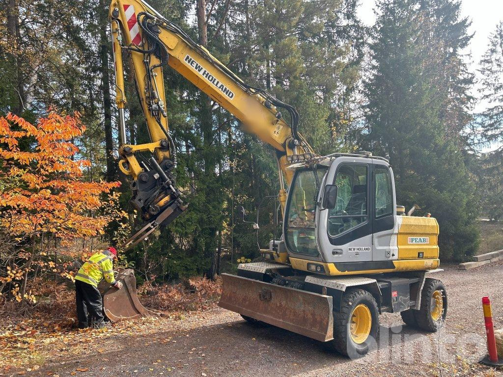 New Holland MH 4.6 - Ratinis ekskavatorius: foto 1 New Holland MH 4.6 - Ratinis ekskavatorius: foto 1